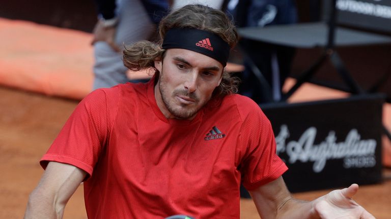 Greece's Stefanos Tsitsipas returns the ball to Serbia's Novak Djokovic during their quarter-final match at the Italian Open tennis tournament, in Rome, Saturday, May 15, 2021. (AP Photo/Gregorio Borgia)
