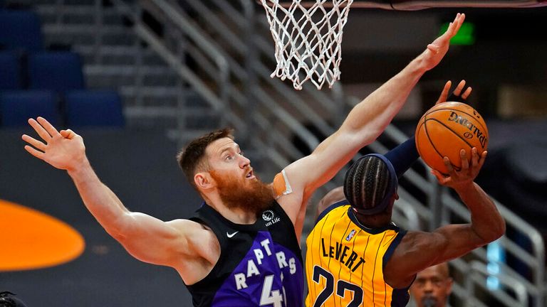 Toronto Raptors center Aron Baynes (46) goes up to blocka shot by Indiana Pacers guard Caris LeVert (22) during the first half of an NBA basketball game Sunday, May 16, 2021, in Tampa, Fla. (AP Photo/Chris O&#39;Meara)