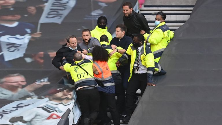 Tottenham supporters and stewards after Spurs' defeat to Aston Villa