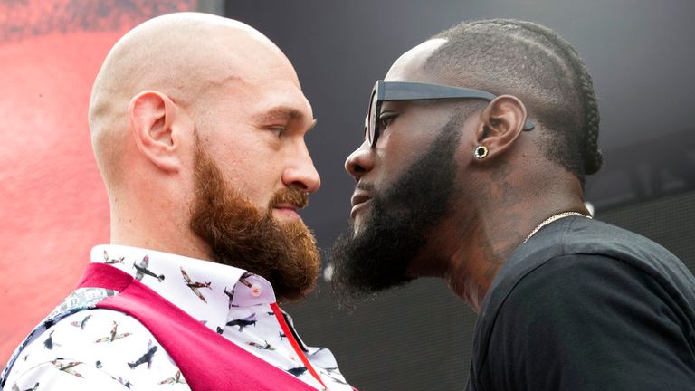 Tyson Fury, left, and Deontay Wilder face off, Tuesday, Oct. 2, 2018, during a news conference in New York ahead of their heavyweight world title showdown in Los Angeles on December 1. (AP Photo/Mary Altaffer)