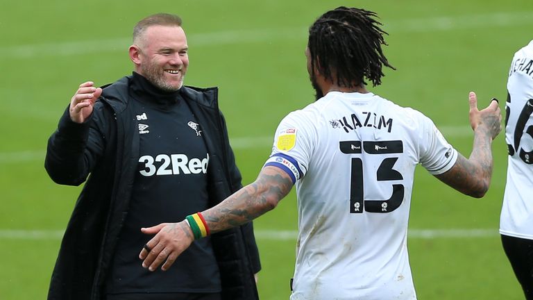 Wayne Rooney and Colin Kazim-Richards celebrate as Derby avoid relegation from the Championship