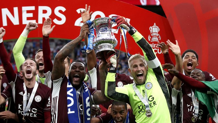 PA - Wes Morgan and Kasper Schmeichel lift the FA Cup at Wembley