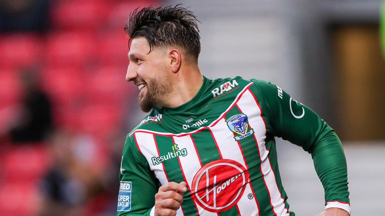 Gareth Widdop celebrates scoring a try.