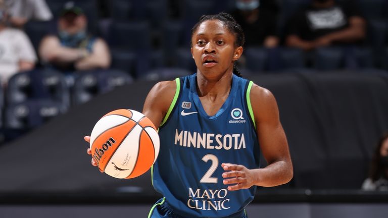 Crystal Dangerfield of the Minnesota Lynx dribbles the ball during the game against the Seattle Storm