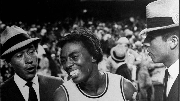 Olympic officials come to the aid of U.S. runner Wyomia Tyus after she won the gold medal in the women's 100-meter dash in the Olympic games in Mexico City, October 16, 1968. Tyus became the only woman to win the 100-meter dash twice.