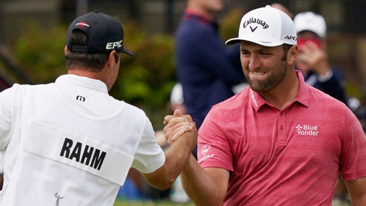 Jon Rahm, of Spain, celebrates with his caddy after making his birdie putt on the 18th green during the final round of the U.S. Open Golf Championship, Sunday, June 20, 2021, at Torrey Pines Golf Course in San Diego. (AP Photo/Marcio Jose Sanchez)