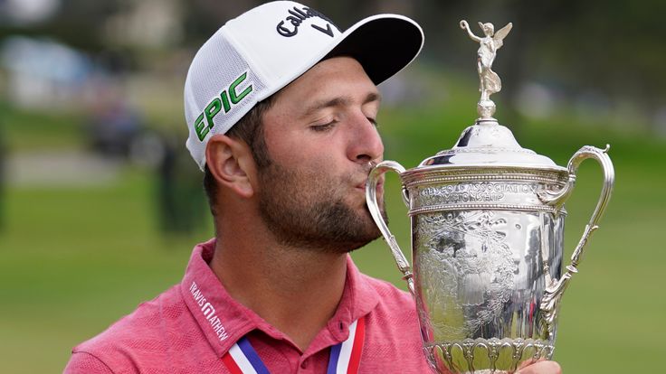 Jon Rahm, of Spain, kisses the champions trophy for photographers after the final round of the U.S. Open Golf Championship, Sunday, June 20, 2021, at Torrey Pines Golf Course in San Diego.  (AP Photo/Marcio Jose Sanchez)