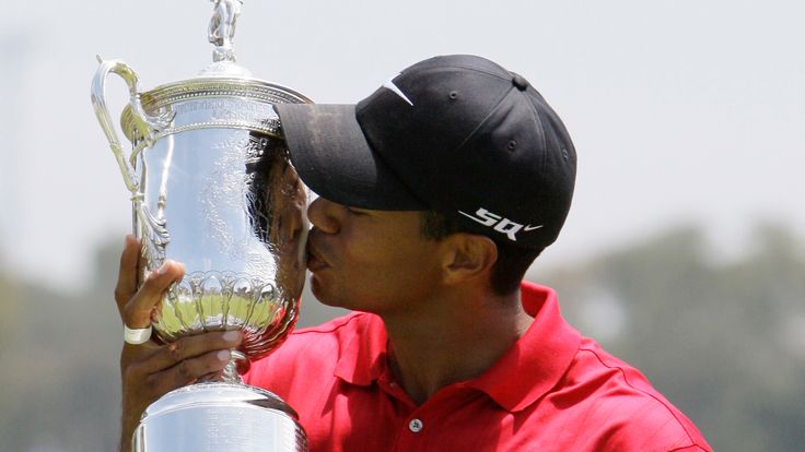 Tiger Woods kisses his US Open championship trophy after winning a sudden death hole against Rocco Mediate following an 18-hole playoff round for the US Open championship at Torrey Pines Golf Course on Monday, June 16, 2008 in San Diego.  (AP Photo/Chris Carlson) (AP Photo/Chris Carlson)