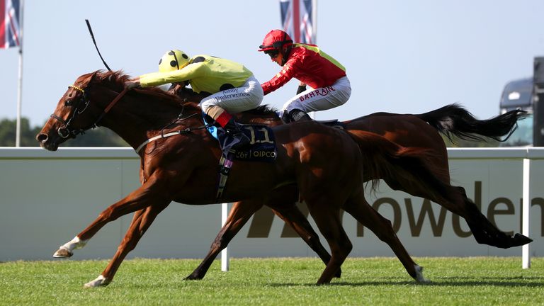 Juan Elcano ridden by Andrea Atzeni (left) on their way to winning the Wolferton Stakes 