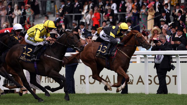 Perfect Power ridden by jockey Paul Hanagan (no.12) on their way to winning the Norfolk Stakes