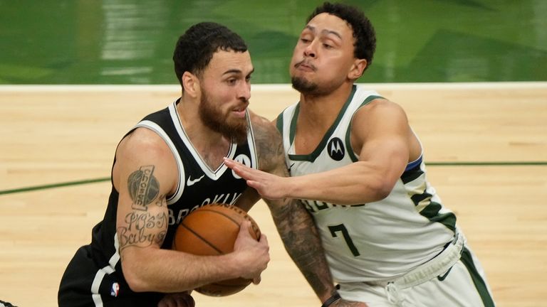 Brooklyn Nets&#39; Mike James tries to drive past Milwaukee Bucks&#39; Bryn Forbes during the second half of Game 4 of the NBA Eastern Conference basketball semifinals game Sunday, June 13, 2021, in Milwaukee.