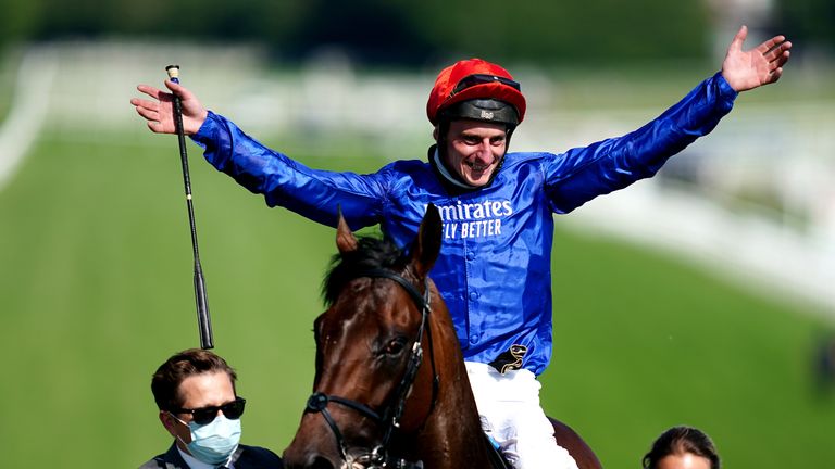 Adam Kirby celebrates victory in the Epsom Derby on board Adayar