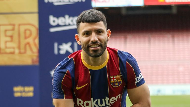 Argentinian forward Sergio 'Kun' Aguero poses for the media during his official presentation after signing for FC Barcelona in Barcelona, Spain, Monday May. 31, 2021