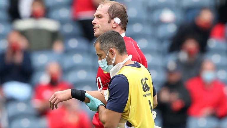 Alun Wyn Jones is helped off the field after injuring himself against Japan (Getty)