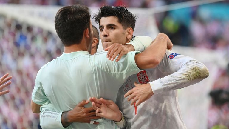 Spain's Alvaro Morata is congratulated after scoring his side's fourth goal during the Euro 2020 soccer championship round of 16 match between Croatia and Spain at the Parken Stadium in Copenhagen