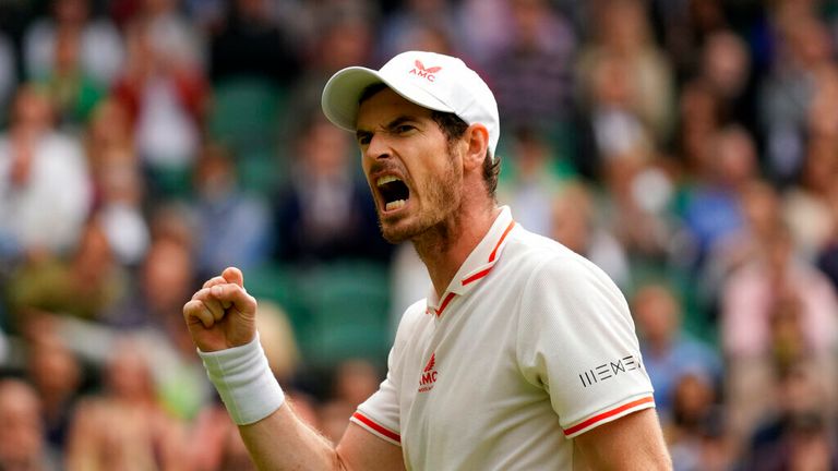 Britain's Andy Murray celebrates winning a point against Georgia's Nikoloz Basilashvili during the men's singles match on day one of the Wimbledon Tennis Championships in London, Monday June 28, 2021. (AP Photo/Kirsty Wigglesworth)