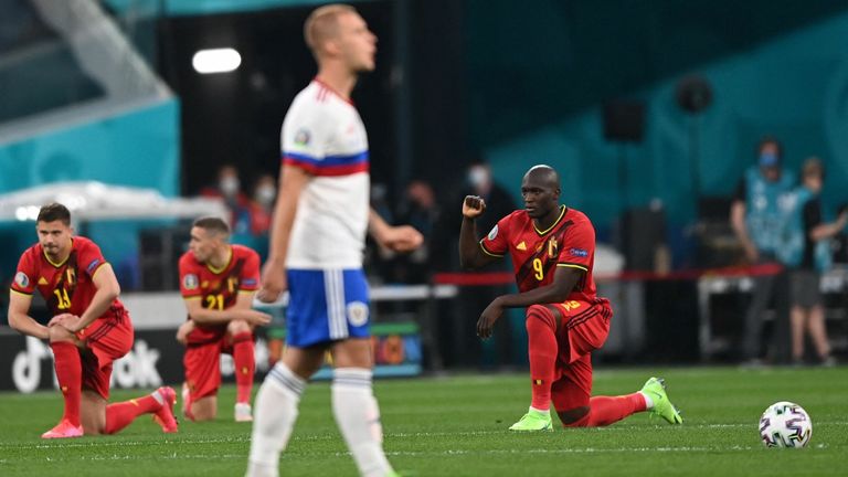 Belgium players knelt before their match against Russia in an anti-racism gesture