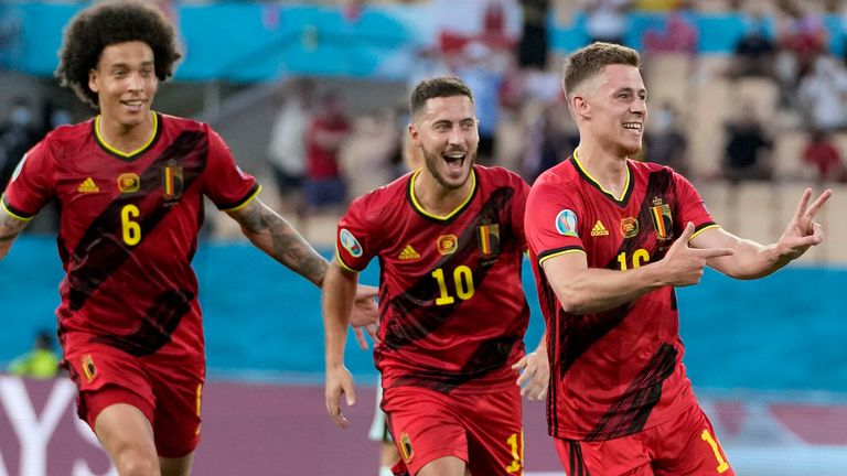Thorgan Hazard, Eden Hazard and Axel Witsel celebrate Belgium's opener against Portugal
