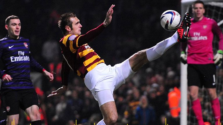 Bradford City&#39;s James Hanson attempts to control the ball near Arsenal&#39;s goal during the League Cup clash in 2012
