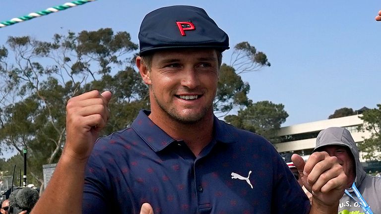 Bryson DeChambeau greets fans as he walks to the 16th tee during the third round of the U.S. Open Golf Championship, Saturday, June 19, 2021, at Torrey Pines Golf Course in San Diego. (AP Photo/Gregory Bull)