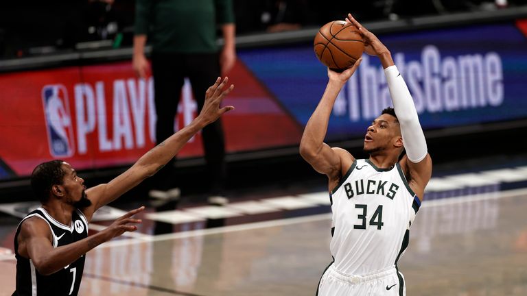 Milwaukee Bucks forward Giannis Antetokounmpo shoots over Brooklyn Nets forward Kevin Durant during Game 1 of an NBA basketball second-round playoff series