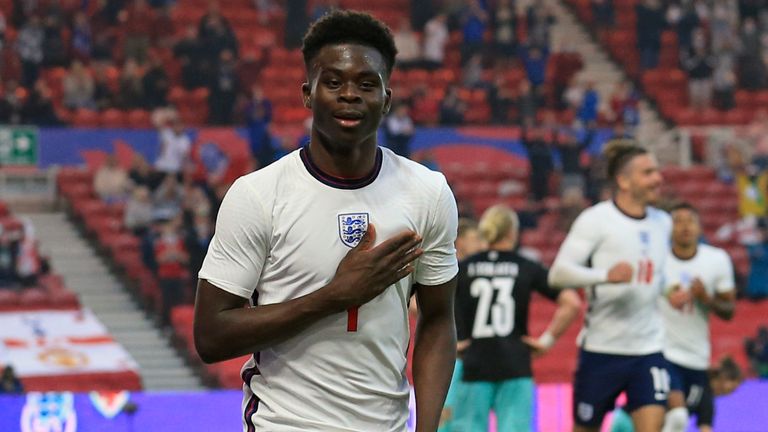 England's Bukayo Saka celebrates after scoring the opening goal during the international friendly soccer match between England and Austria at the Riverside stadium in Middlesbrough, England, Wednesday June 2, 2021. (Lindsey Parnaby, Pool via AP)