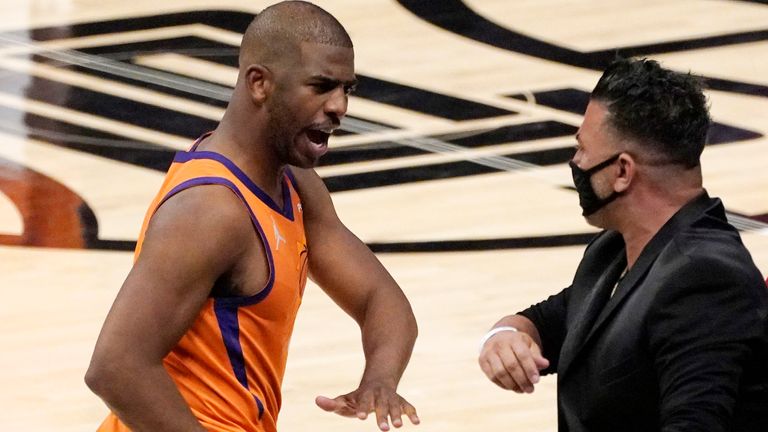 Phoenix Suns guard Chris Paul, left, celebrates as time runs out in Game 4 of the NBA basketball Western Conference Finals against the Los Angeles Clippers Saturday, June 26, 2021, in Los Angeles. The Suns won 84-80.