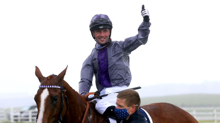 Rory Cleary celebrates victory on board Mac Swiney in the Irish 2,000 Guineas