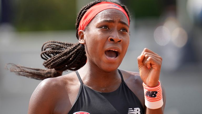 Coco Gauff celebrates after winning a point against China's Qiang Wang during their second round match on day 5, of the French Open tennis tournament at Roland Garros in Paris, France, Thursday, June 3, 2021. (AP Photo/Christophe Ena)