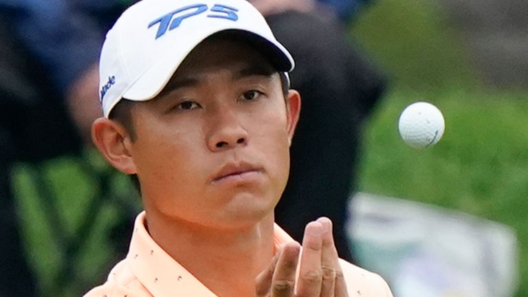 Collin Morikawa tosses his golf ball to his caddie on the 10th hole during the first round of the Memorial golf tournament, Thursday, June 3, 2021, in Dublin, Ohio. (AP Photo/Darron Cummings) 