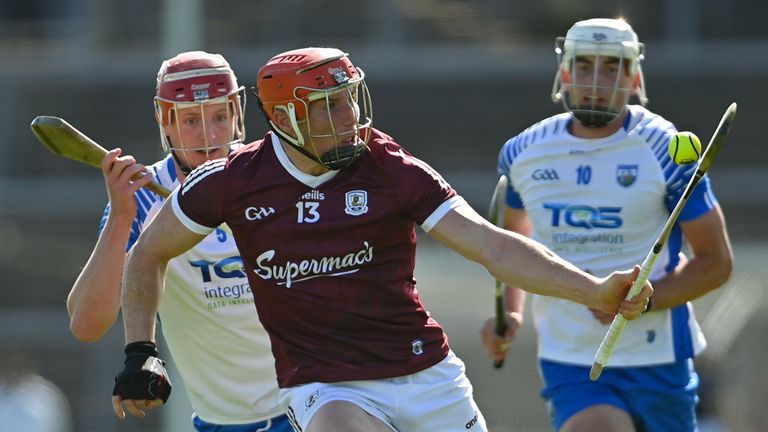 Conor Whelan of Galway gets away from Calum Lyons, left, and Neil Montgomery of Waterford