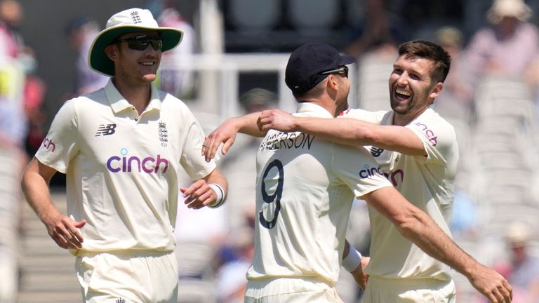 England's Mark Wood (R) celebrates a wicket with James Anderson (Associated Press)