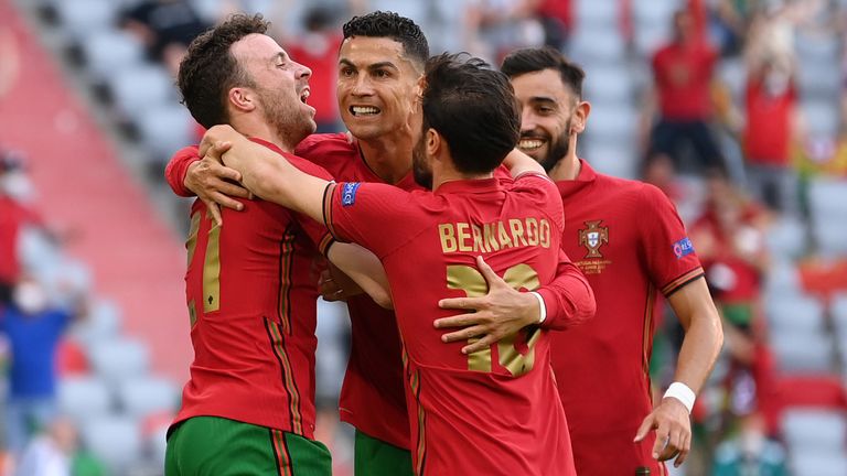 Portugal's Cristiano Ronaldo celebrates with Diogo Jota and Bernardo Silva after scoring against Germany
