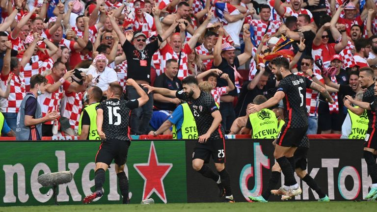 Croatia's Mario Pasalic, left, celebrates after scoring his side's third goal during the Euro 2020 soccer championship round of 16 match between Croatia and Spain at Parken stadium in Copenhagen,