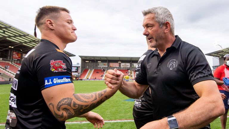 Picture by Allan McKenzie/SWpix.com - 05/06/2021 - Rugby League - Betfred Challenge Cup Semi Final - Castleford Tigers v Warrington Wolves - Leigh Sports Village, Leigh , England - Castleford's Tyla Hepi is congratulated by head coach Daryl Powell after their side defeats Warrington.