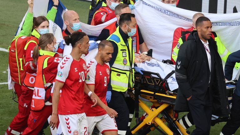 A protective curtain was raised as Eriksen received treatment