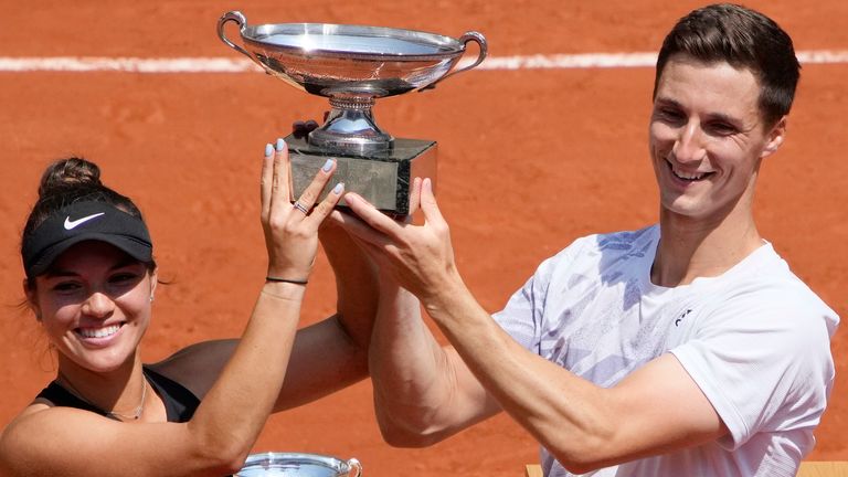USA's Desirae Krawczyk, left, and Britain's Joe Salisbury hold the cup after defeating Russia's Elena Vesnina and Aslan Karatsev in their mixed doubles final match of the French Open tennis tournament at the Roland Garros stadium Thursday, Junn tennis tournament at the Roland Garros stadium Thursday, June 10e 10, 2021 in Paris. (AP Photo/Christophe Ena)
