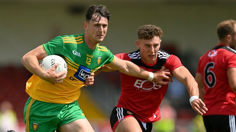 Michael Langan of Donegal in action against Pierce Laverty of Down
