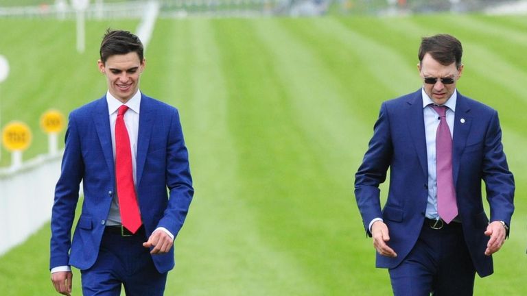 Donnacha, left, walks the track with father Aidan O'Brien