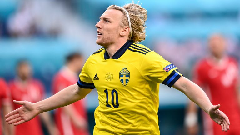 Sweden's Emil Forsberg celebrates after scoring early against Poland (AP)