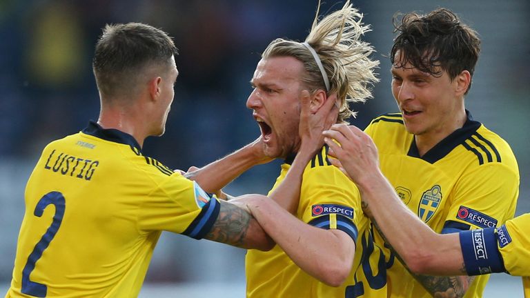 Emil Forsberg celebrates with team-mates Mikael Lustig and Victor Lindelof after scoring Sweden's equaliser