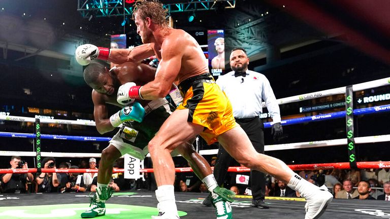 Floyd Mayweather, left, and Logan Paul fight during an exhibition boxing match at Hard Rock Stadium, Sunday, June 6, 2021, in Miami Gardens, Fla. (AP Photo/Lynne Sladky)