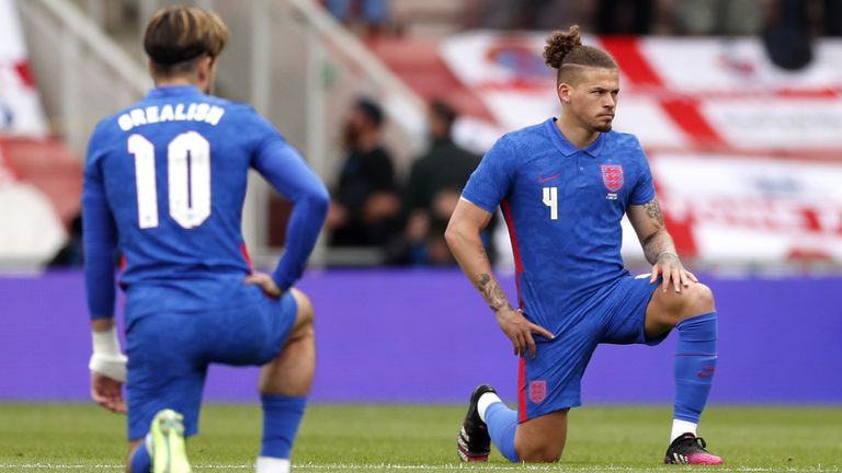 England players take a knee prior to kick-off against Romania (PA)