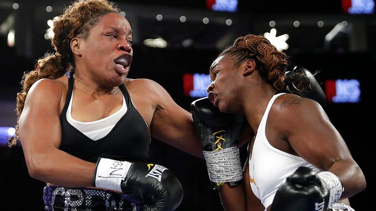 Franchon Crews, left, fights Claressa Shields during a women's super middleweight bout, Saturday, Nov. 19, 2016, in Las Vegas. (AP Photo/John Locher).