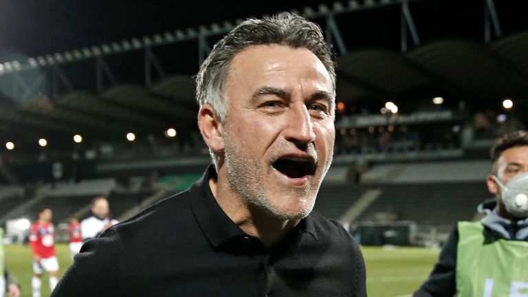 Lille's head coach Christophe Galtier celebrates after the French League One soccer match between Angers and Lille at the Raymond Kopa Stadium in Angers, France, Sunday May 23, 2021. Lille won the match 2-1 to clinch the French League One title. (AP Photo/Lewis Joly)