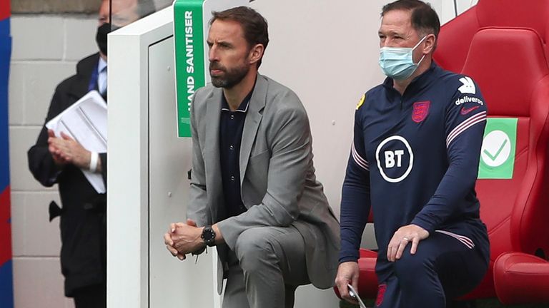 England manager Gareth Southgate (left) takes a knee (AP)