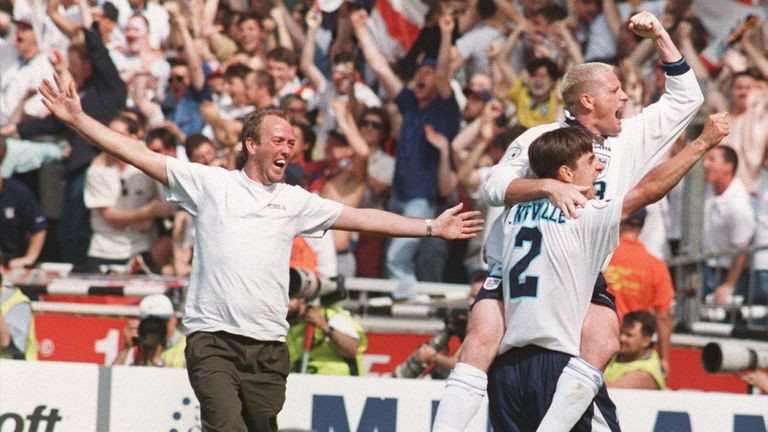 Neville celebrates with Paul Gascoigne as a England supporters runs onto the Wembley pitch