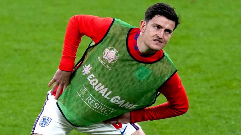 England's Harry Maguire warms up on the pitch at half-time during the UEFA Euro 2020 Group D match at Wembley Stadium