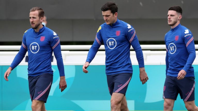 Harry Maguire arrives for training with Harry Kane (L) and Declan Rice (R) (PA)
