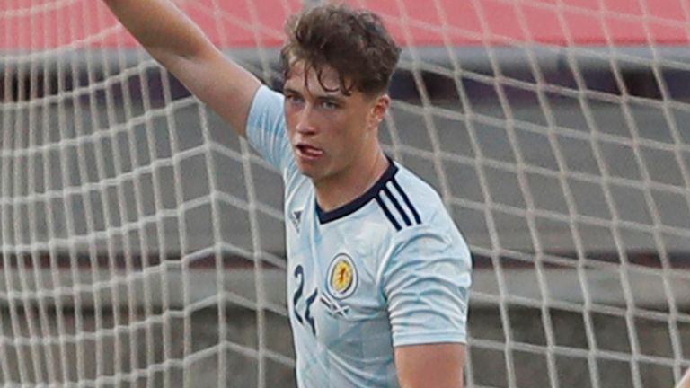 Scotland's Jack Hendry, left, celebrates after scoring his side's opening goal during the international friendly soccer match between the Netherlands and Scotland at the Algarve stadium outside Faro, Portugal, Wednesday June 2, 2021. (AP Photo/Miguel Morenatti)